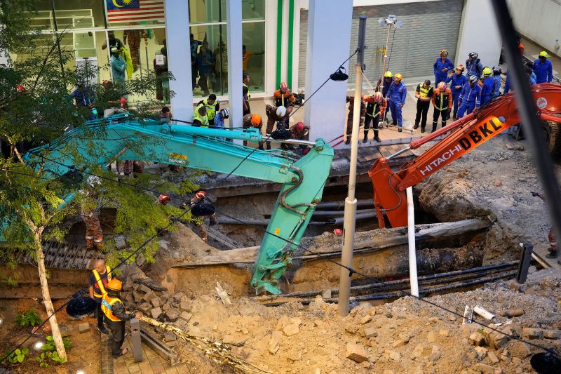 Malaysia halts rescue operation for woman who plunged into sinkhole