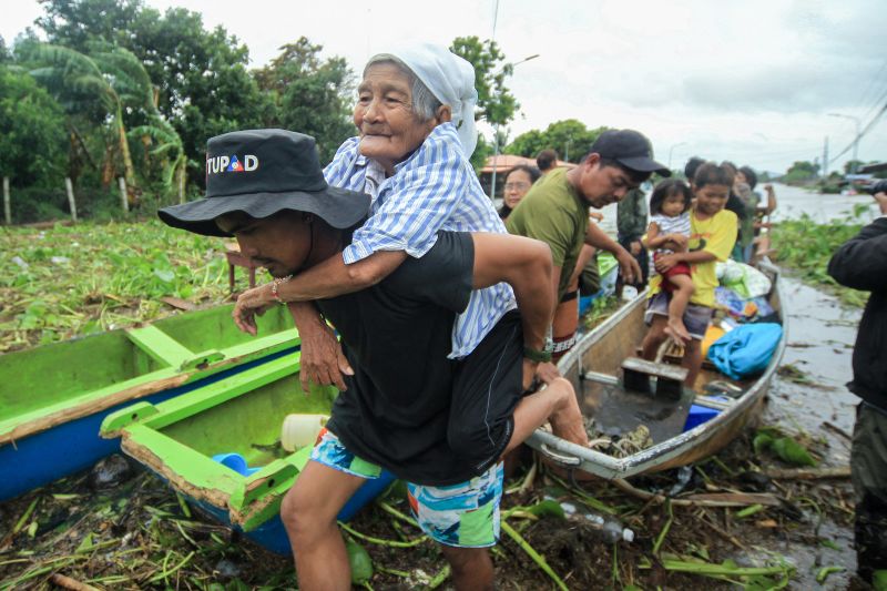 Tropical Storm Trami brings severe flooding and landslides to the Philippines, at least two dozen dead